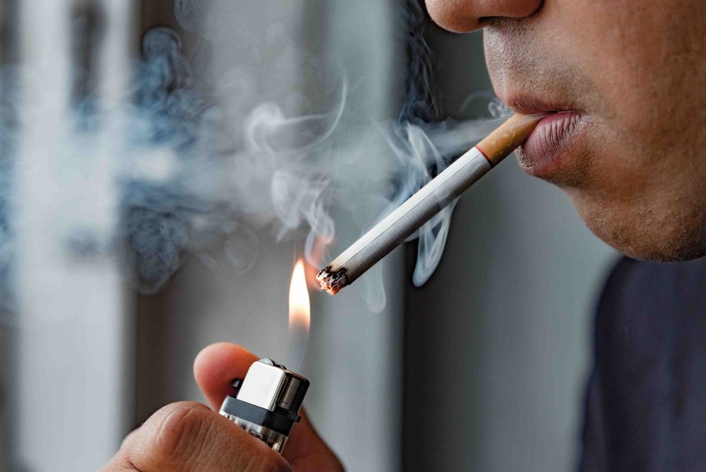 1701185516 man smoking a cigarette 1 1