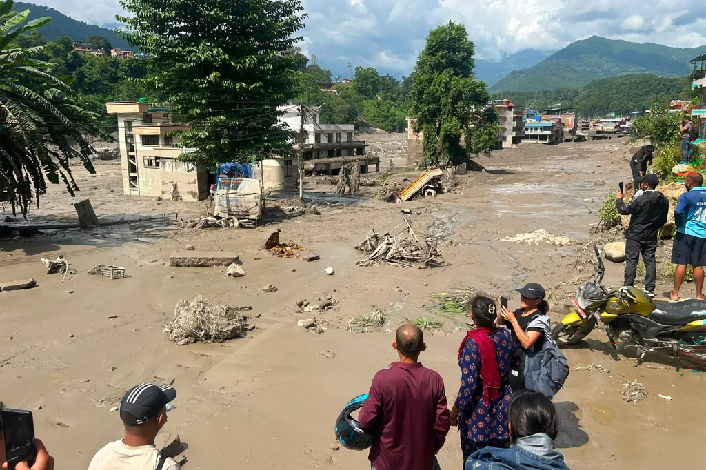 AFP 20260826 C6HV3ZQ v2 HighRes TopshotNepalWeatherFlood 1787738051