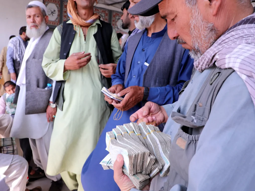 2021 11 22T000000Z 1503266959 RC2GZQ9EBFLI RTRMADP 3 AFGHANISTAN CONFLICT BANKING