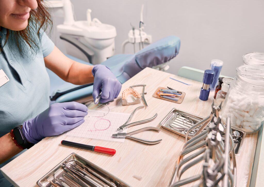female orthodontist working in dental office 1024x725 1