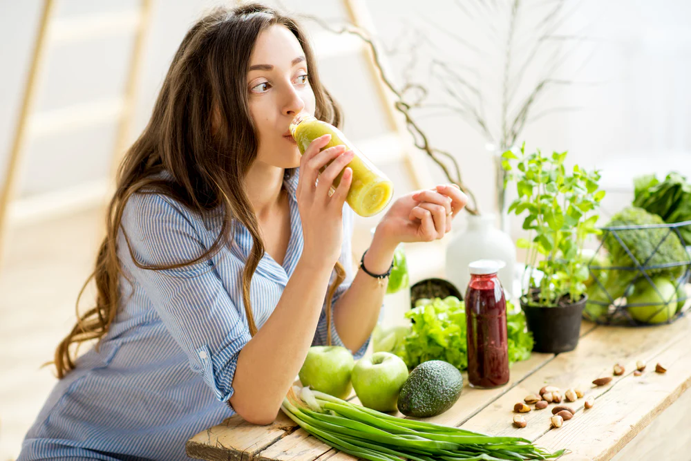 woman drinking her daily green veggies 1