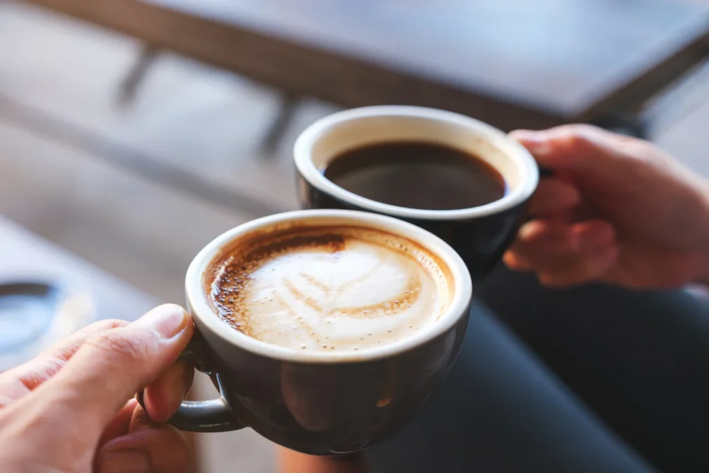 two people drinking coffee 1200x1200 1