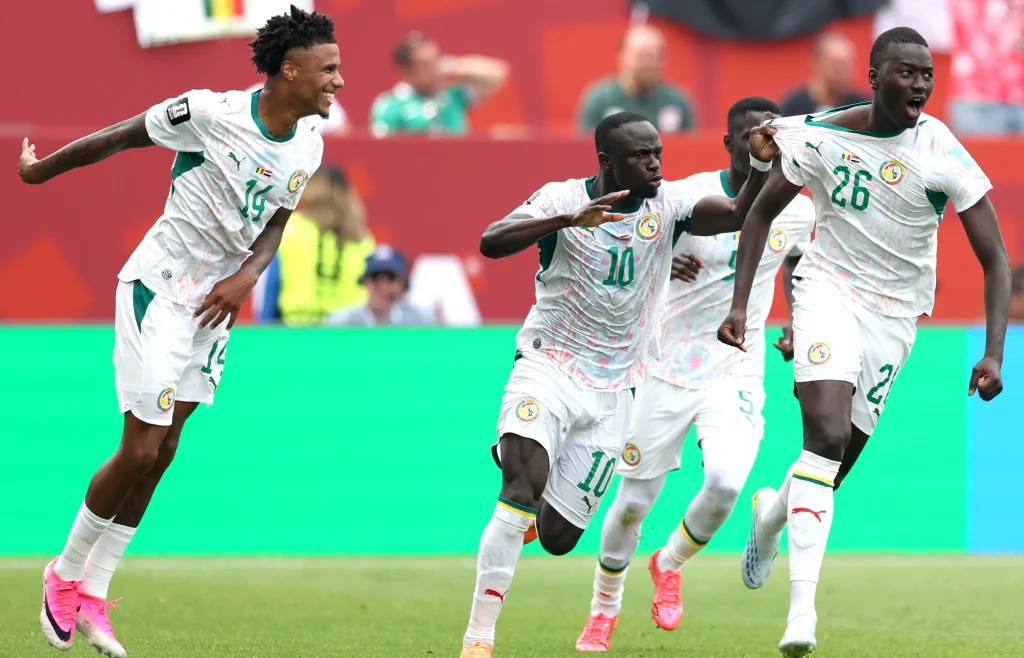 pape gueye celebrates two goals in senegal win over iraq 1